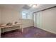 Unfinished basement storage area with a window, linoleum flooring, and large closet at 2101 Kinridge Rd, Marietta, GA 30062