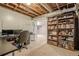 Basement workspace with desk, built in shelves, and lots of storage space at 2101 Kinridge Rd, Marietta, GA 30062