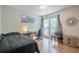 Comfortable bedroom with hardwood floors and large windows with a view to the back porch at 2101 Kinridge Rd, Marietta, GA 30062