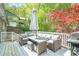 Relaxing deck with outdoor seating and a grill, perfect for enjoying the surrounding lush greenery at 2101 Kinridge Rd, Marietta, GA 30062