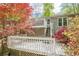 Multi-level deck perfect for outdoor dining and entertaining, surrounded by vibrant foliage at 2101 Kinridge Rd, Marietta, GA 30062