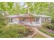 Charming single story home with a welcoming front porch and colorful garden at 2101 Kinridge Rd, Marietta, GA 30062