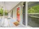 Welcoming front porch featuring a colorful door, black shutters, and charming details at 2101 Kinridge Rd, Marietta, GA 30062
