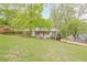 Attractive front yard with mature trees and landscaping leading up to a well-maintained house at 2101 Kinridge Rd, Marietta, GA 30062