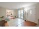 Bright living room with hardwood floors and a glimpse of the dining area and outdoor view at 2101 Kinridge Rd, Marietta, GA 30062