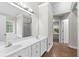 Bathroom featuring double vanity, tile flooring, bathtub, and shower at 2443 High Meadows Ct, Conyers, GA 30094