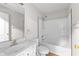 Bright bathroom featuring a shower-tub combination and a single sink vanity at 2443 High Meadows Ct, Conyers, GA 30094
