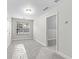 An empty room filled with neutral carpet, a large window and natural lighting at 2443 High Meadows Ct, Conyers, GA 30094