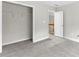 Bedroom with carpeted floor, closet and door to the hallway at 2443 High Meadows Ct, Conyers, GA 30094