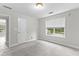 Empty bedroom filled with neutral carpet, a large window and natural lighting at 2443 High Meadows Ct, Conyers, GA 30094