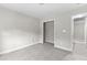Bedroom with carpeted floor and a closet at 2443 High Meadows Ct, Conyers, GA 30094
