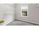 Walk-in closet with carpeted floor, wire shelving and a window at 2443 High Meadows Ct, Conyers, GA 30094