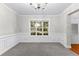 Bright dining room with crown molding, large window, and neutral paint at 2443 High Meadows Ct, Conyers, GA 30094