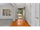 Welcoming foyer with hardwood floors and neutral walls, creating a warm ambiance at 2443 High Meadows Ct, Conyers, GA 30094