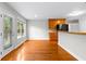 Open kitchen showcasing hardwood floors and seamless access to a sunny deck at 2443 High Meadows Ct, Conyers, GA 30094