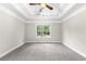 Spacious bedroom featuring tray ceiling, new carpet, and large windows at 2443 High Meadows Ct, Conyers, GA 30094