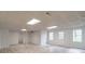 Spacious basement featuring waterproof flooring, paneled walls, bright lighting, and a walk-out entrance at 275 Sageglen Rd, Lawrenceville, GA 30044