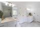 Spacious bathroom with double vanities, tiled floor, and a separate shower at 275 Sageglen Rd, Lawrenceville, GA 30044