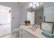 Bathroom with vanity, framed mirror and marble tile at 275 Sageglen Rd, Lawrenceville, GA 30044