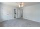 Bedroom with carpet, ceiling fan and view into ensuite bath at 275 Sageglen Rd, Lawrenceville, GA 30044