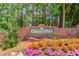 Cooper's Pond entrance sign framed by beautiful landscaping and lush greenery, showcasing a welcoming community at 275 Sageglen Rd, Lawrenceville, GA 30044