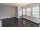 Dining room with hardwood floors, wainscoting and decorative light fixture at 275 Sageglen Rd, Lawrenceville, GA 30044