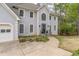 Elegant home featuring a large arched window, two-car garage, and well-maintained landscaping at 275 Sageglen Rd, Lawrenceville, GA 30044