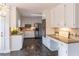 Open kitchen layout features white cabinets, granite counters, and stainless steel appliances at 275 Sageglen Rd, Lawrenceville, GA 30044