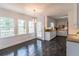 Eat-in kitchen features hardwood floors, white cabinets, and stainless steel appliances at 275 Sageglen Rd, Lawrenceville, GA 30044