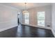 Living room features hardwood floors, stylish lighting, and windows providing natural light at 275 Sageglen Rd, Lawrenceville, GA 30044