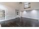 Open-concept living room featuring dark hardwood floors and door to backyard at 275 Sageglen Rd, Lawrenceville, GA 30044