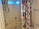 Bathroom with a floral curtain and shower at 6438 Wedgeview Dr, Tucker, GA 30084