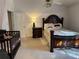 Cozy bedroom with a large bed, crib and dresser at 6438 Wedgeview Dr, Tucker, GA 30084