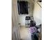 Organized walk-in closet with shelving and hanging clothes at 6438 Wedgeview Dr, Tucker, GA 30084