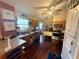 Functional kitchen with dark wood cabinets, granite countertops and stainless steel appliances at 110 N River Rd, Mcdonough, GA 30252