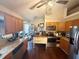 Well-equipped kitchen featuring stainless steel appliances, granite countertops, and dark wood cabinets at 110 N River Rd, Mcdonough, GA 30252