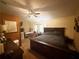 Spacious main bedroom with ceiling fan, and view of a desk, storage, and natural light from windows at 110 N River Rd, Mcdonough, GA 30252