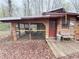 Rustic shed with a chicken coop and a small porch at 110 N River Rd, Mcdonough, GA 30252