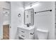 Modern bathroom featuring white vanity with black accents and an elegant frameless mirror at 2000 Grove Ave, East Point, GA 30344