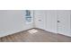 Bedroom featuring a window and two closets with white paneled doors and black hardware at 2000 Grove Ave, East Point, GA 30344