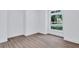 Bright bedroom featuring a large window with natural light and views of the green outdoors at 2000 Grove Ave, East Point, GA 30344