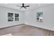 Well-lit bedroom with vinyl plank floors and multiple windows at 2000 Grove Ave, East Point, GA 30344