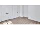 Bedroom featuring two closets with white paneled doors and black hardware at 2000 Grove Ave, East Point, GA 30344