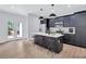 Contemporary kitchen featuring a center island, stainless steel appliances, and a view to the patio at 2000 Grove Ave, East Point, GA 30344