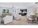 Bright and airy living space with an open layout to the kitchen and dining area at 2000 Grove Ave, East Point, GA 30344