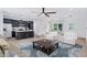 Living area showcasing an open floor plan, kitchen island, and plenty of natural light at 2000 Grove Ave, East Point, GA 30344