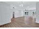 Open-concept living area with wood floors, recessed lighting, and a ceiling fan at 2000 Grove Ave, East Point, GA 30344