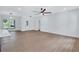 Open-concept living room with recessed lighting, a ceiling fan, and view of the outside at 2000 Grove Ave, East Point, GA 30344