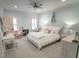 Bright bedroom featuring plush carpet, ceiling fan, and natural light at 3224 Lanier Ne Dr, Atlanta, GA 30319
