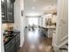 Butler's pantry featuring sleek black countertops, custom cabinetry, and seamless transition to the kitchen and dining area at 3224 Lanier Ne Dr, Atlanta, GA 30319
